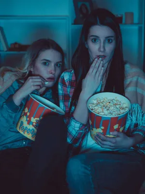 The two women with a popcorn watch Both Eyes Open
