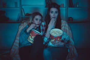 The two women with a popcorn watch Both Eyes Open