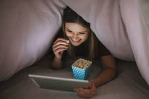 woman watching bring them down movie. 