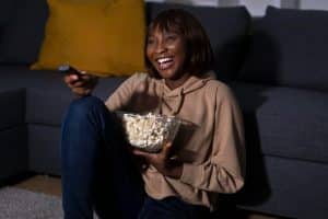 woman watching bring them down movie.